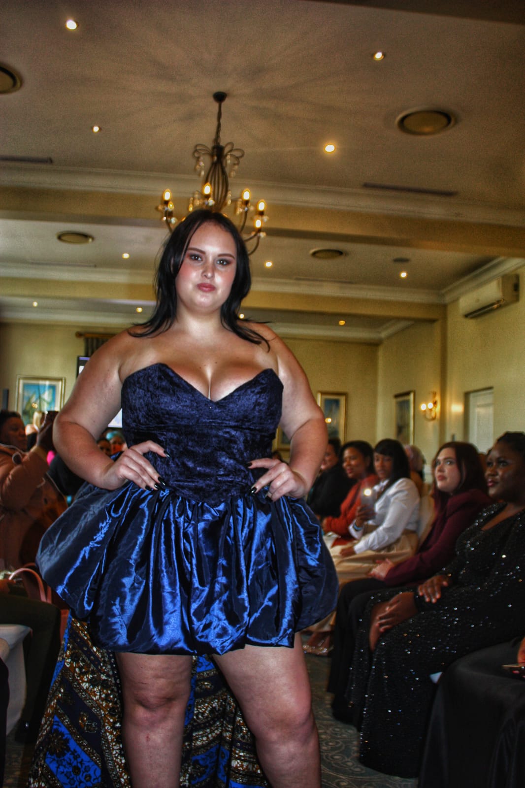 Navy velvet and satin gown on the runway